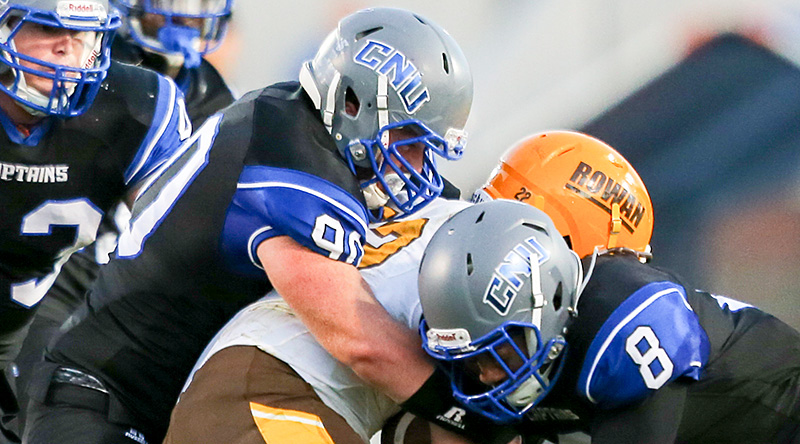 Chris Coggins and B.J. Hill wrap up an unsuccessful Rowan ballcarrier. 