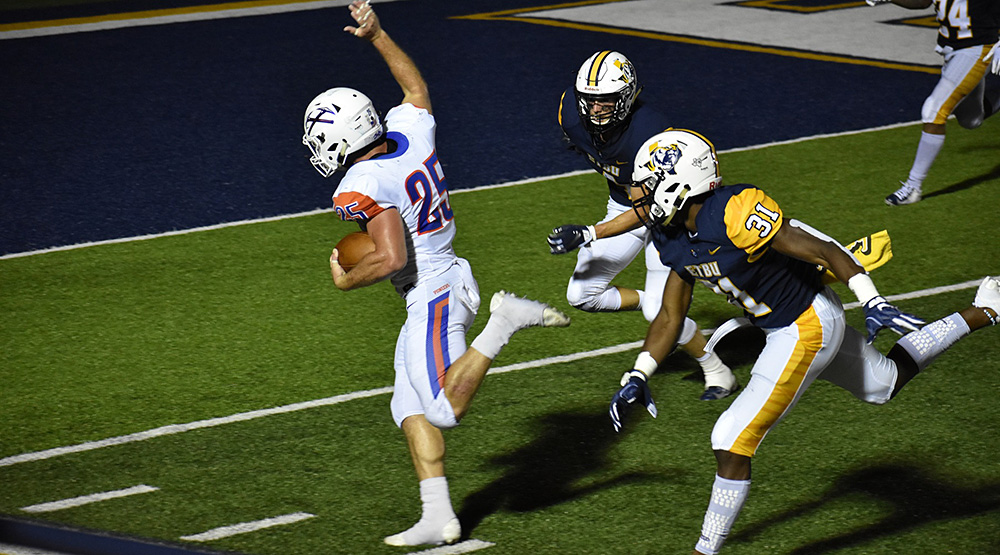 Sean Studer tiptoes along the sidelines for UWP.